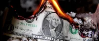 image of a burning dollar bill